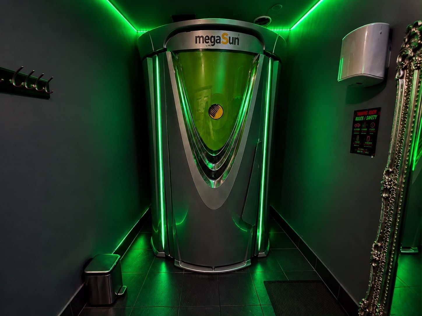 MegaSun standing tanning unit at Glow Zone, Madhouse Carlton